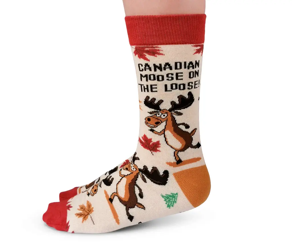 Side view of beige socks with brown moose & colorful maple leaves print, text 'Canadian Moose on the Loose'