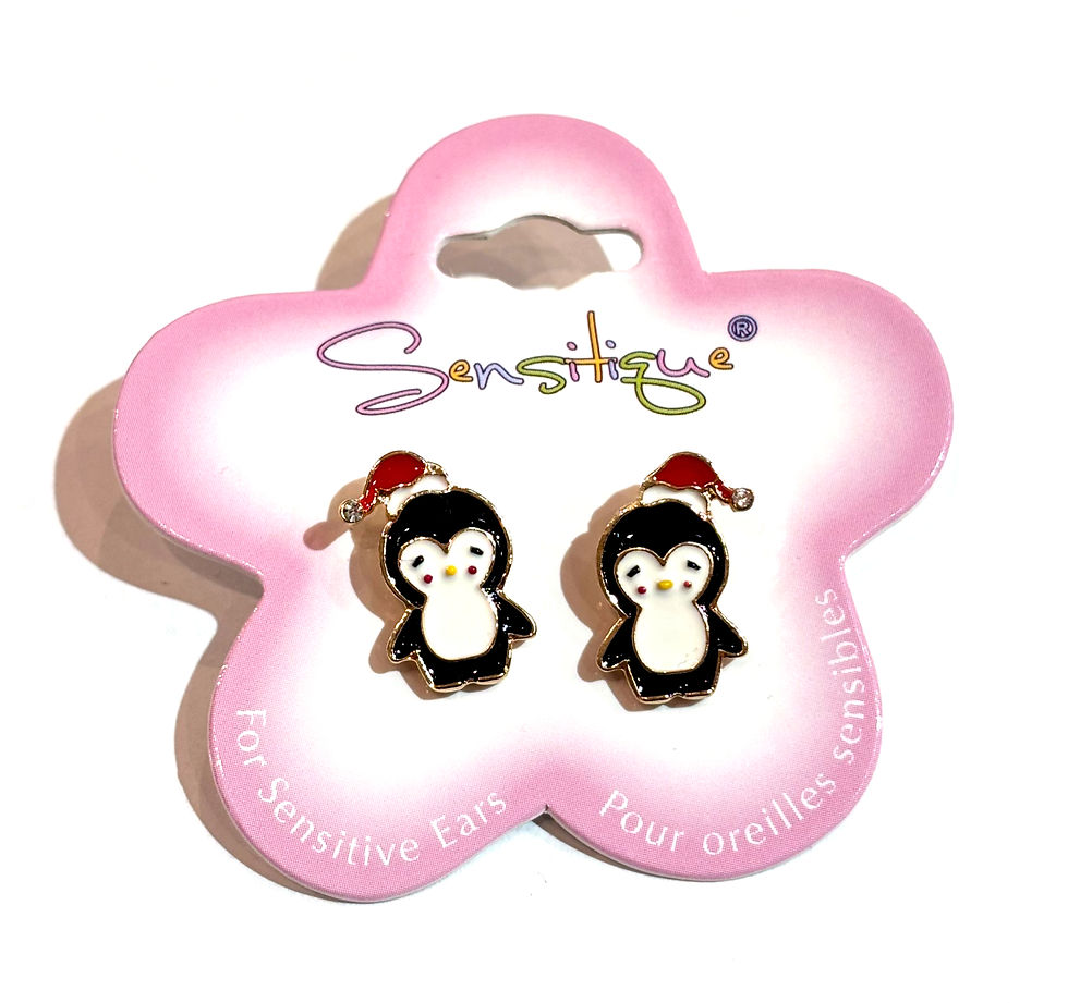 Pink & white flower shaped card holding pair of stud earrings in shape of black & white penguin with red hat