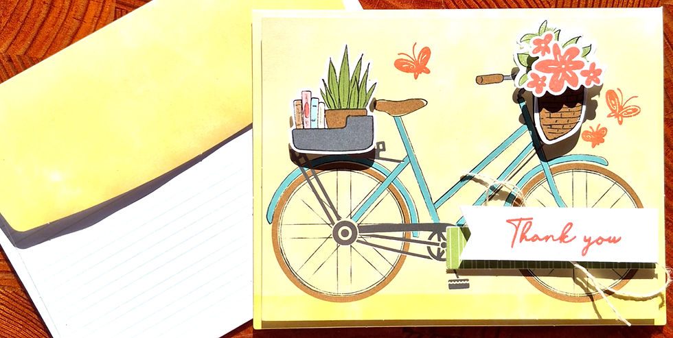 A handmade Thank You bicycle card displayed next to its matching yellow envelope at Tickled Pink.
