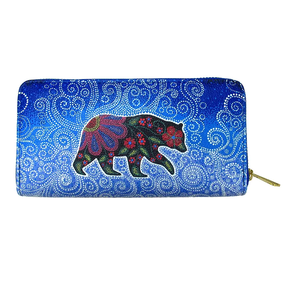 Front of blue rectangular zippered faux leather wallet featuring artist Kim McDonough's painting 'Celestial Bear'