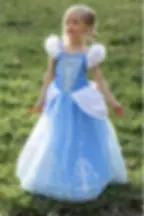 Little girl wearing elaborate child's Cinderella blue & white dress up gown