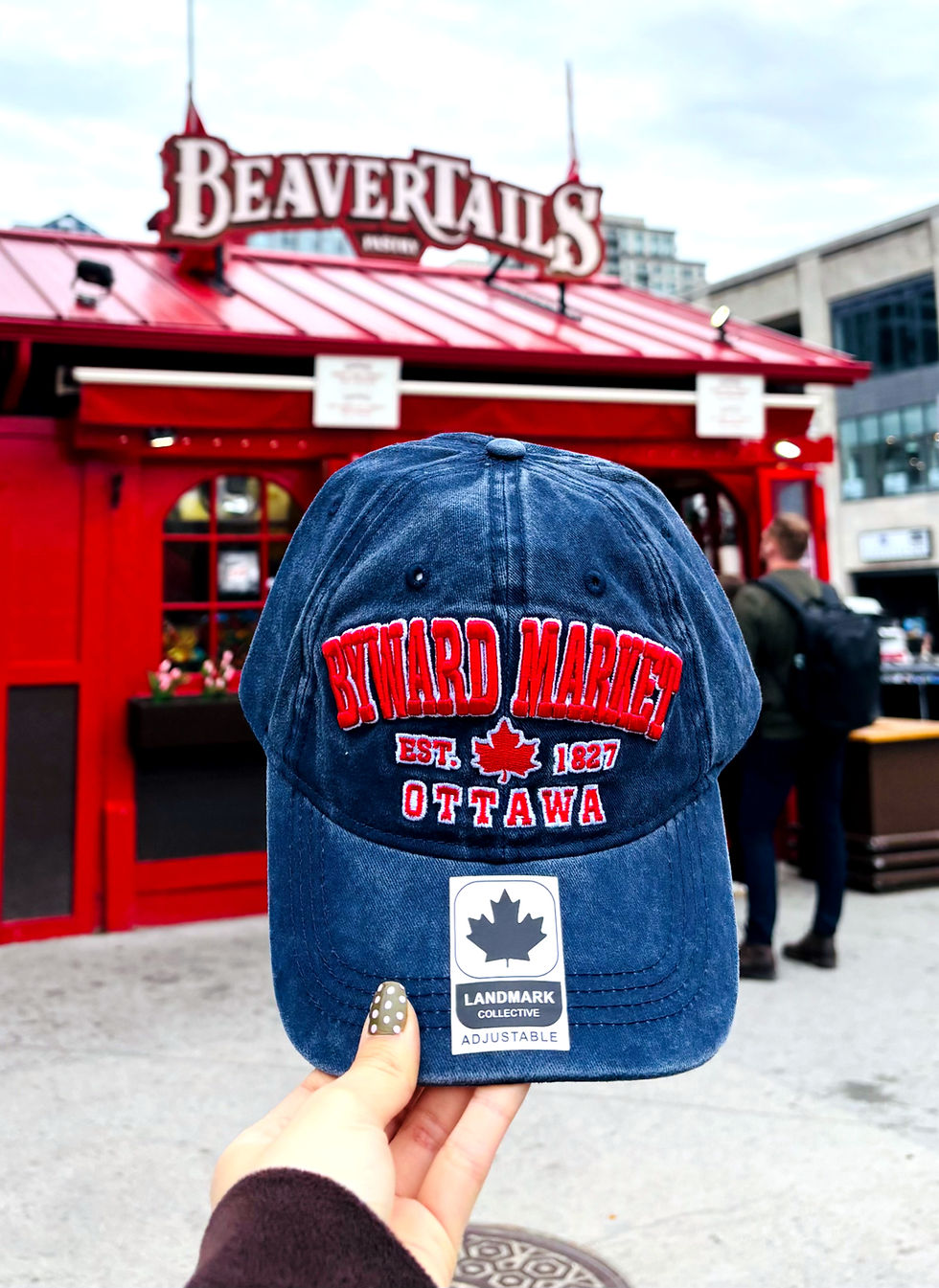 Lifestyle view of retro-washed navy Byward Market baseball cap at Ticked Pink Ottawa