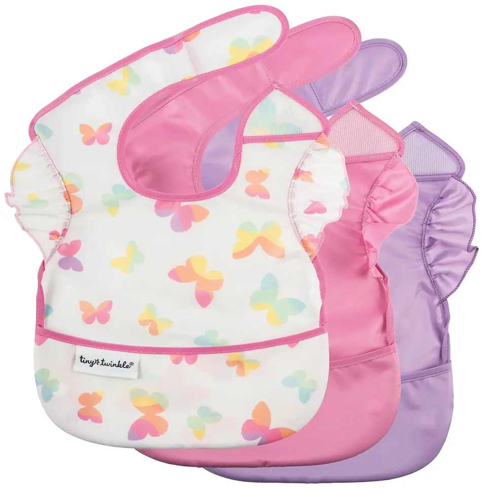 A 3-pack of ruffled Tiny Twinkle easy bibs in butterfly, solid pink, and purple prints at Tickled Pink.