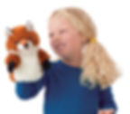 Thumbnail: Little girl holding rust, black & white plush fox hand puppet