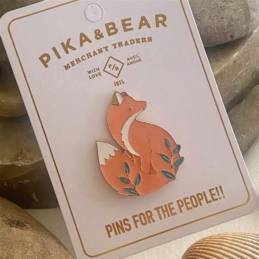 Celeste Fox Enamel Lapel Pin on white card packaging