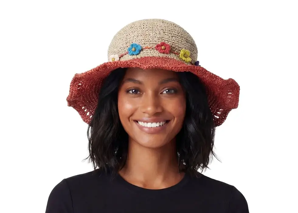 Model in sun hat with natural hemp colour crown & red brim with hatband of multi-colour flowers