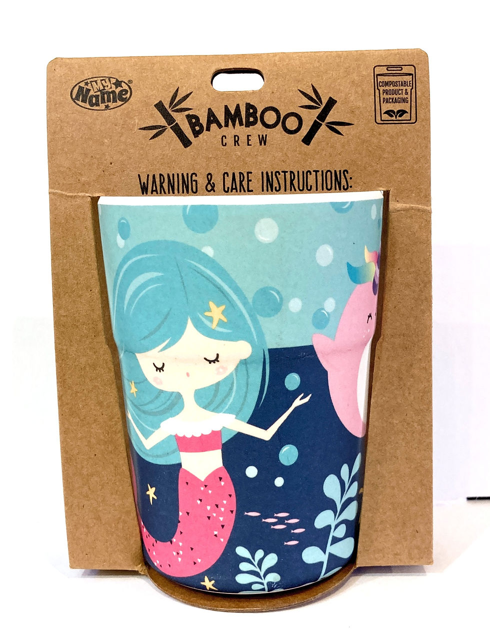 Back of colorful mermaid beaker with pretty mermaids & black text on brown cardboard packaging 'Warning & Care Instructions'