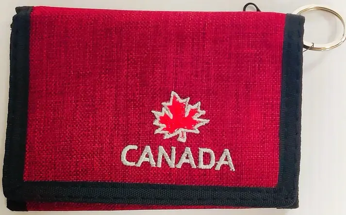 Red fabric folded wallet with red maple leaf & 'Canada' embroidered in white