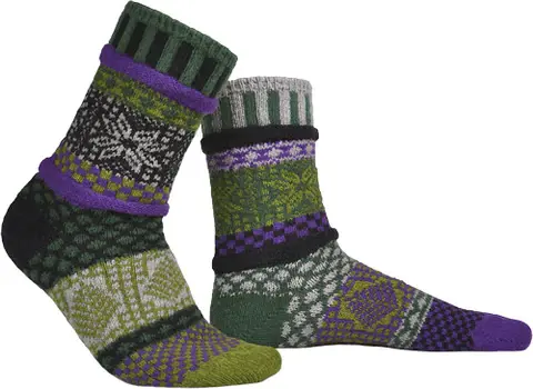 Multiple shades of green & a little purple mismatched crew socks in knit pattern