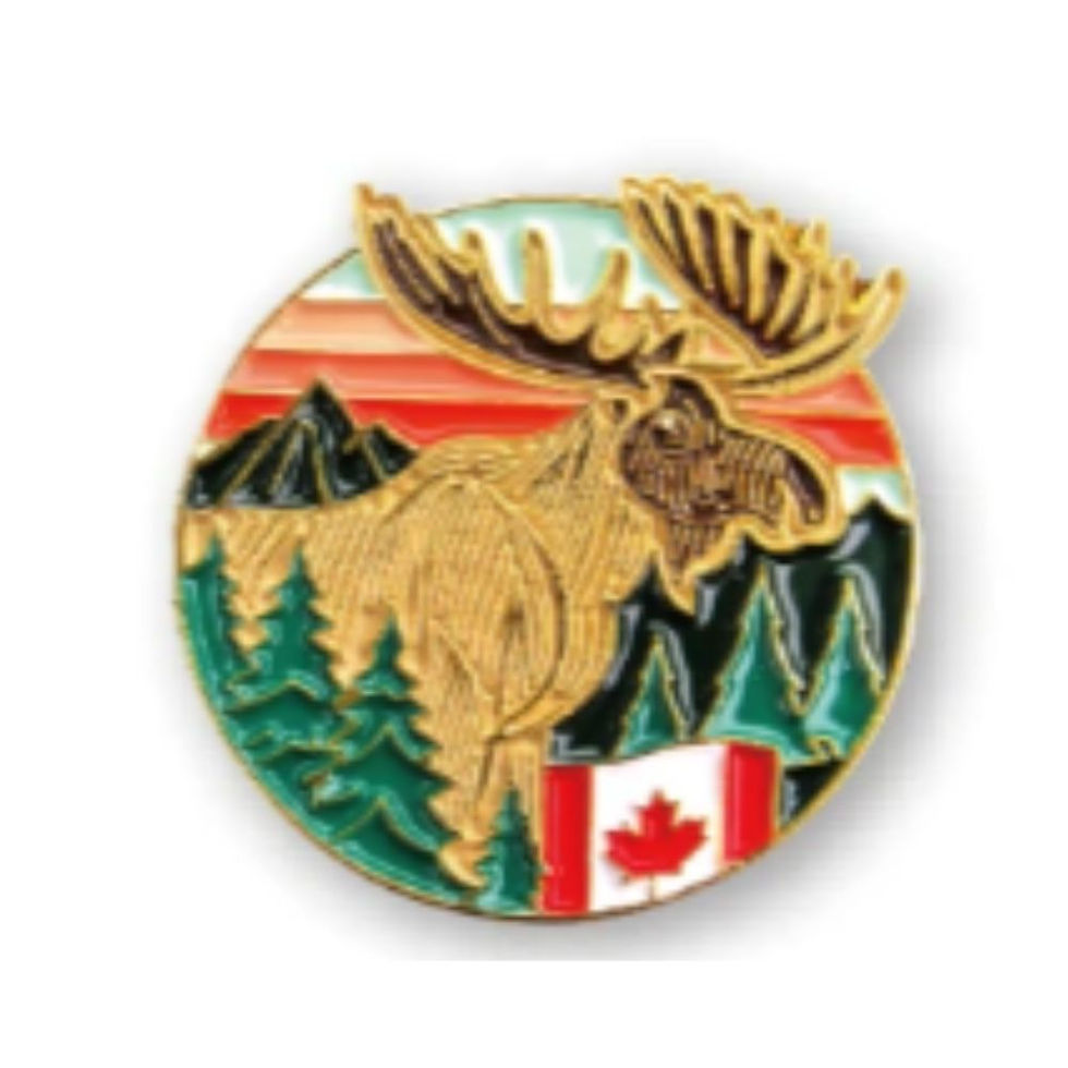Tickled Pink's circular Canada enamel pin featuring a majestic moose, wilderness landscape, and Canadian flag.