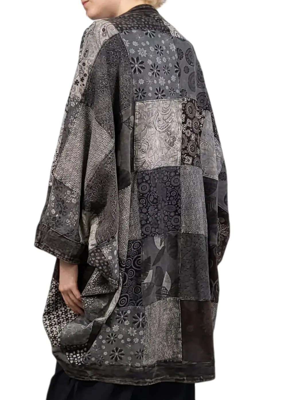 Thumbnail: Back view of model in cocoon shaped kimono style long jacket of black patchwork with long sleeves