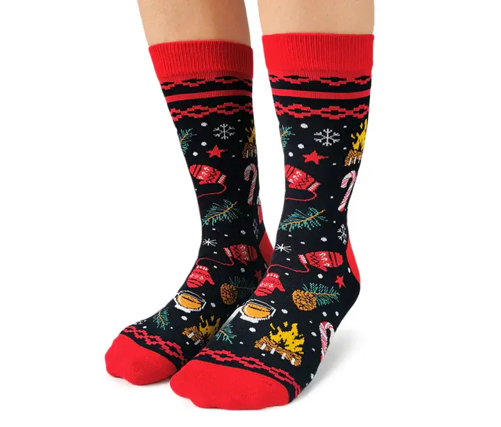 Angled front-left view of pair of black & red socks & festive holiday print