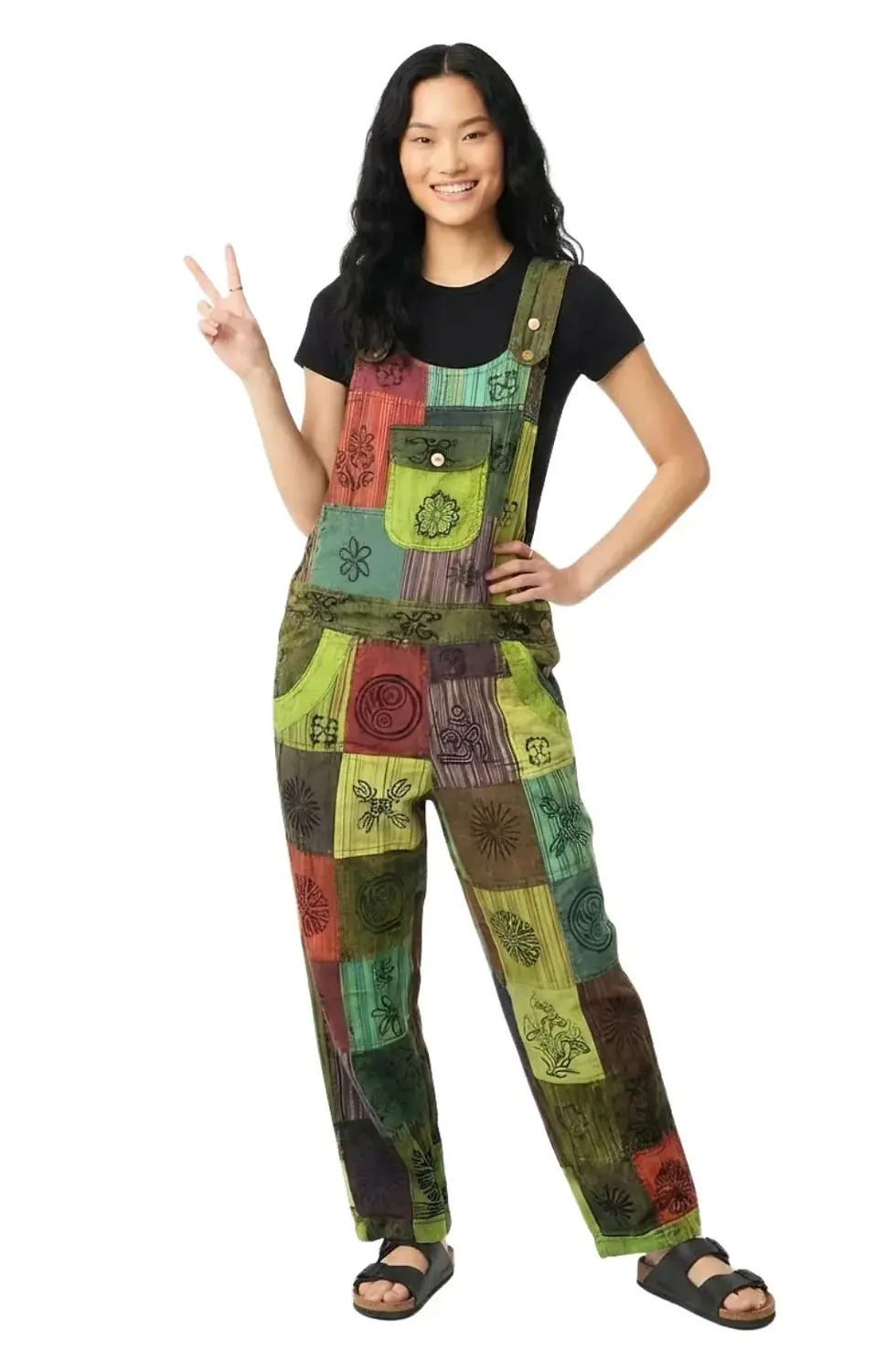 Model wearing primarily lime green patchwork overalls with flap pocket on bib