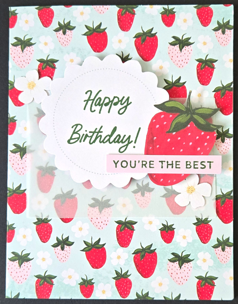 Handmade card with strawberry pattern, a scalloped Happy Birthday circle, and You're The Best text at Tickled Pink.