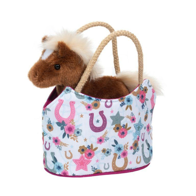 Front view of white print purse with pink & purple flowers & horseshoes & brown horse stuffed toy inside