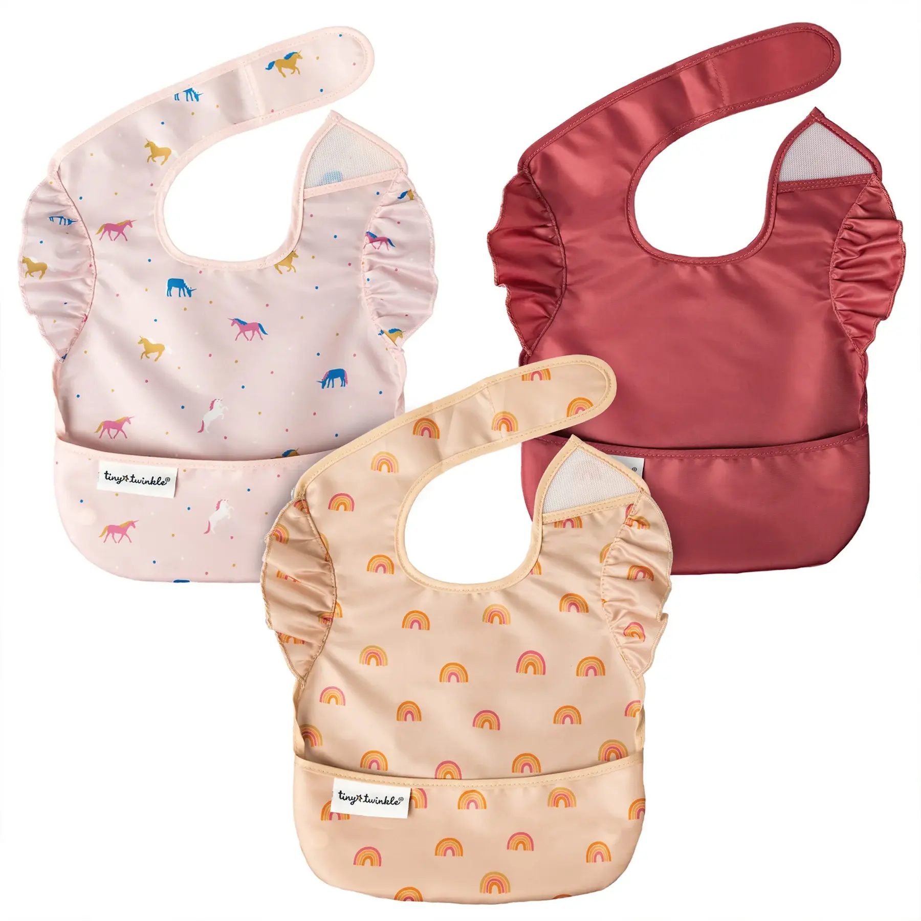A 3-pack of ruffled Tiny Twinkle easy bibs in unicorn, rainbow, and solid burgundy prints at Tickled Pink.