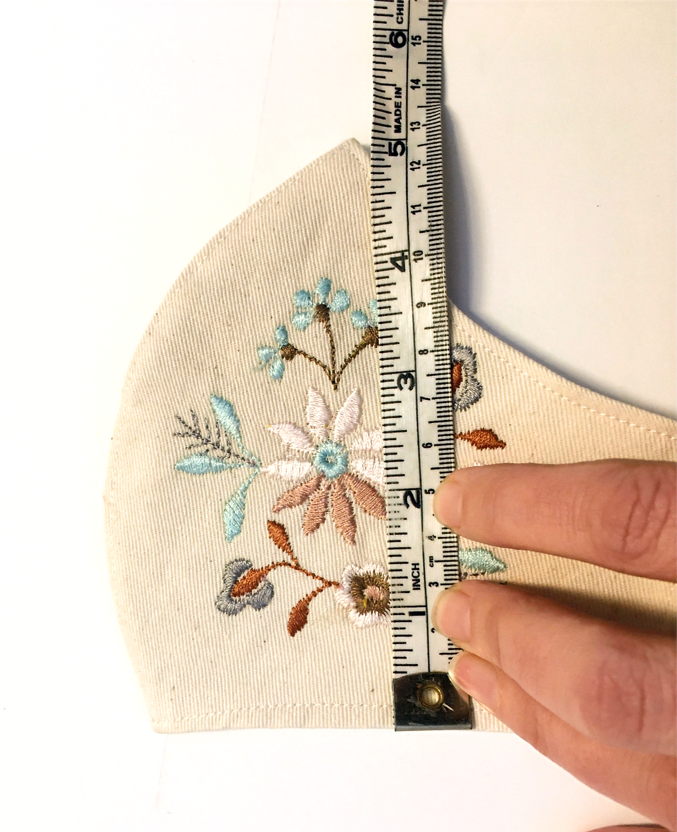 Thumbnail: Measuring tape across sample mask showing height of 6"