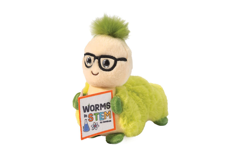 Stuffed toy green worm with glasses holding a book