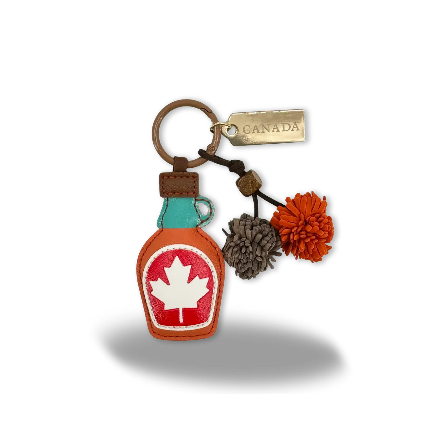 Bag charm/keychain shaped like bottle of maple syrup at Tickled Pink Ottawa