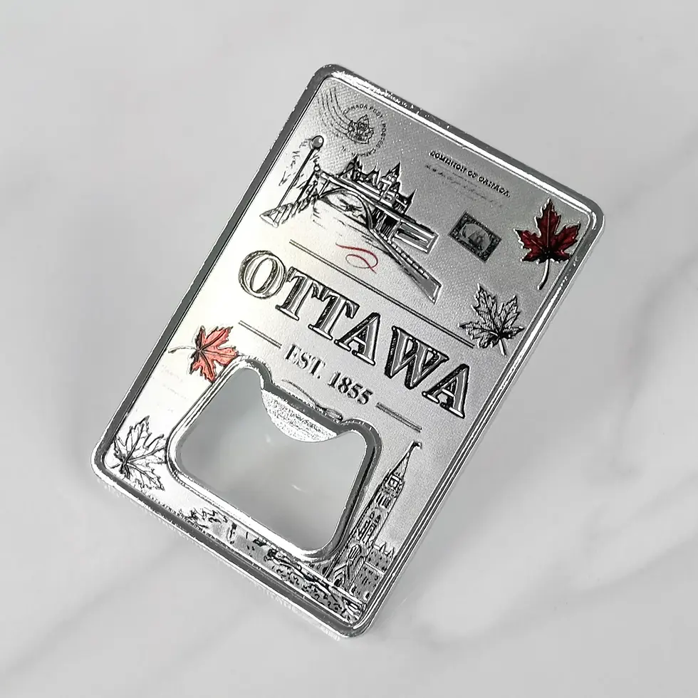 Rectangular metal magnetic bottle opener with images of maple leaves & iconic Ottawa sites