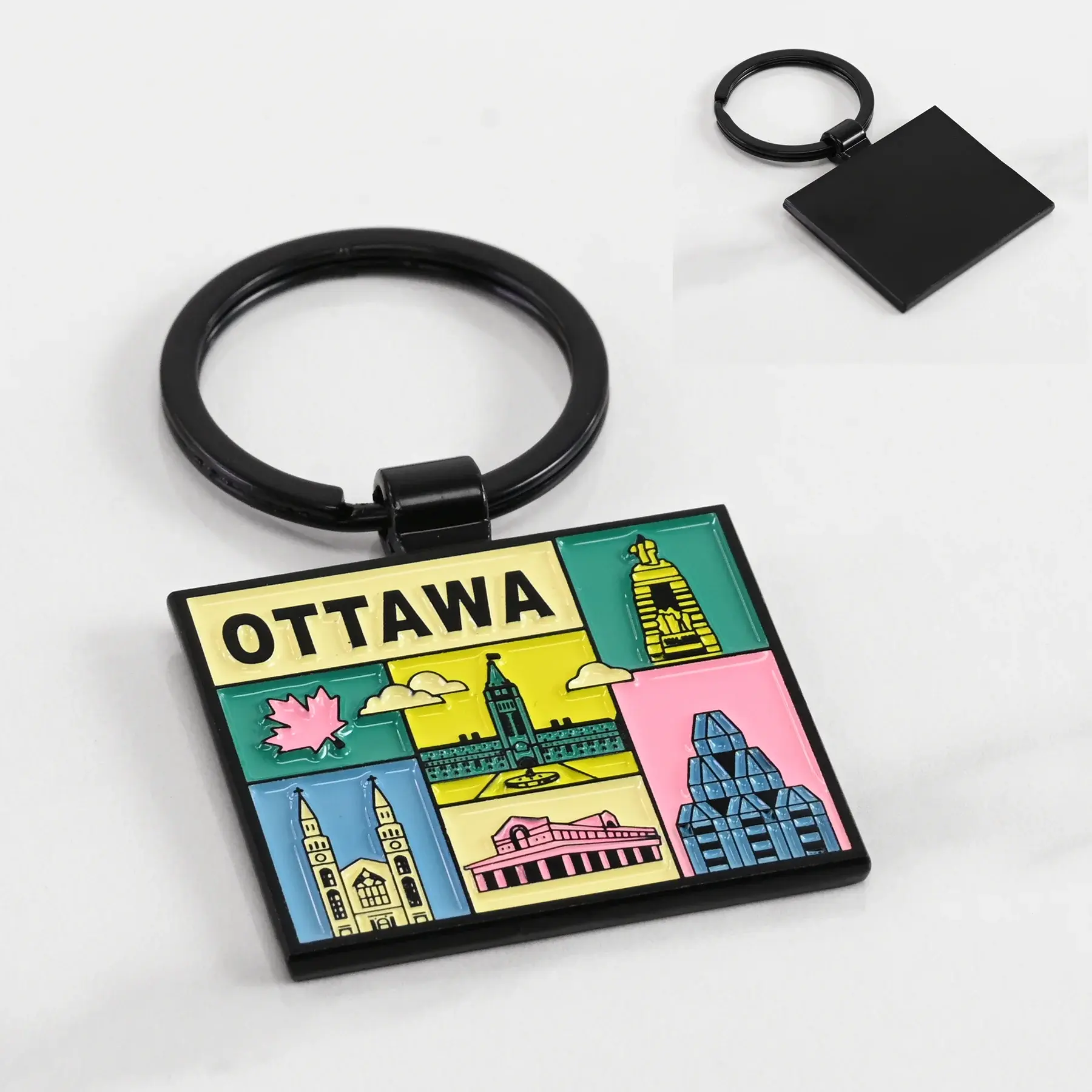 Front & back views of enamel grid keychain with Parliament Hill and Gallery illustrations at Tickled Pink Ottawa.
