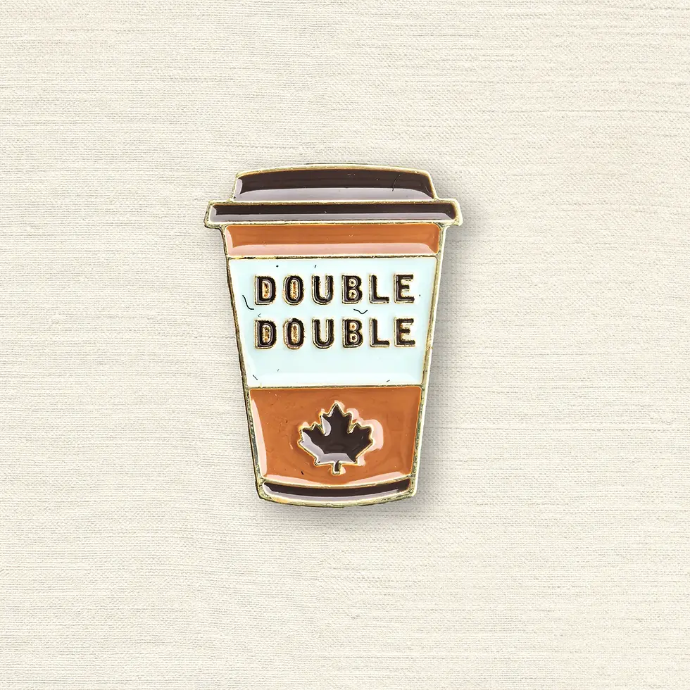 Brown & white enamel pin in shape of coffee cup with text, 'Double Double'