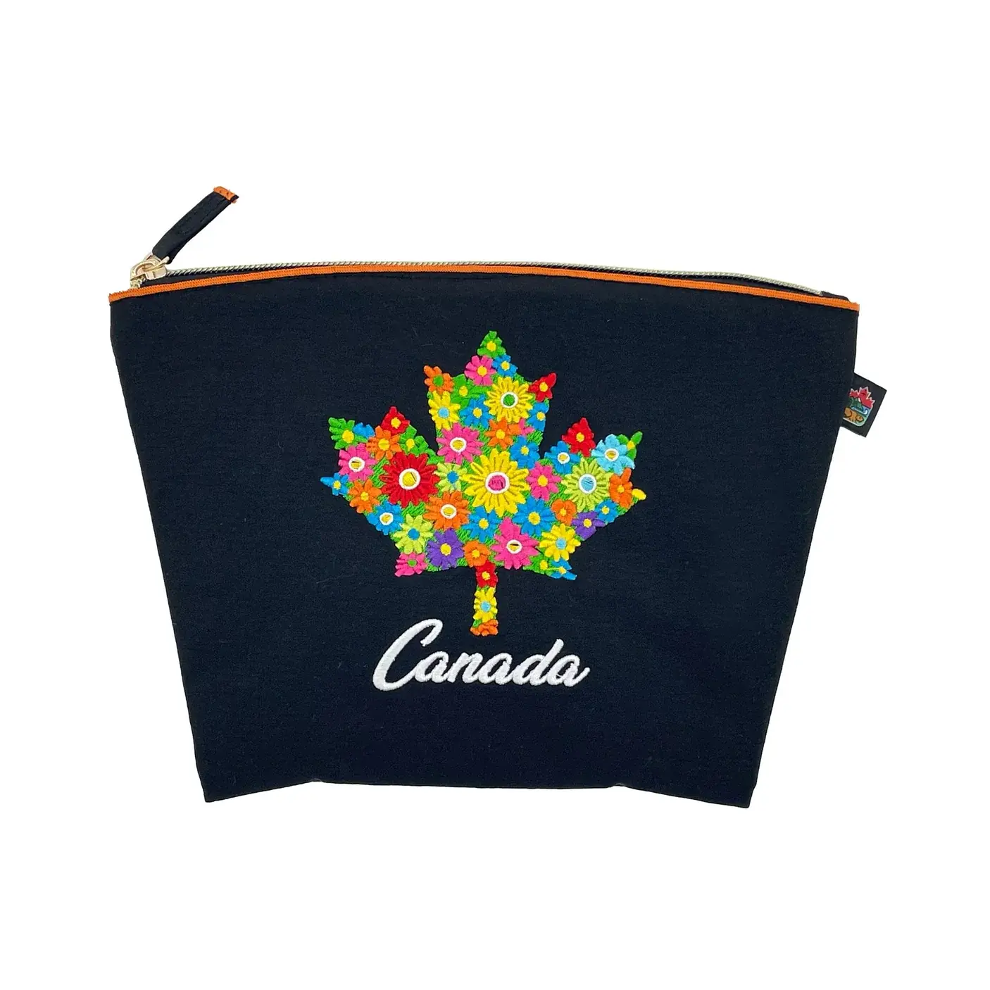 Vibrant floral maple leaf design on navy canvas zipper pouch at Tickled Pink Ottawa.