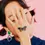 Thumbnail: Model holding hand over face with tattoo of very colorful butterfly on back