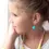 Thumbnail: Little girl wearing beaded necklace & bracelet set in vivid teal, pink & yellow beads