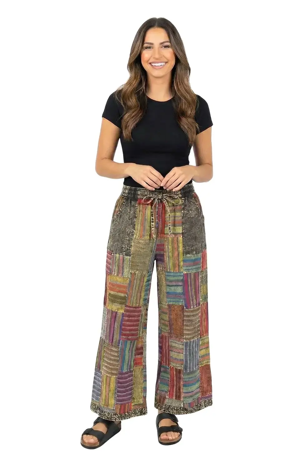 Thumbnail: Front view of model in wide leg mainly black & green striped patchwork pants with drawstring waist