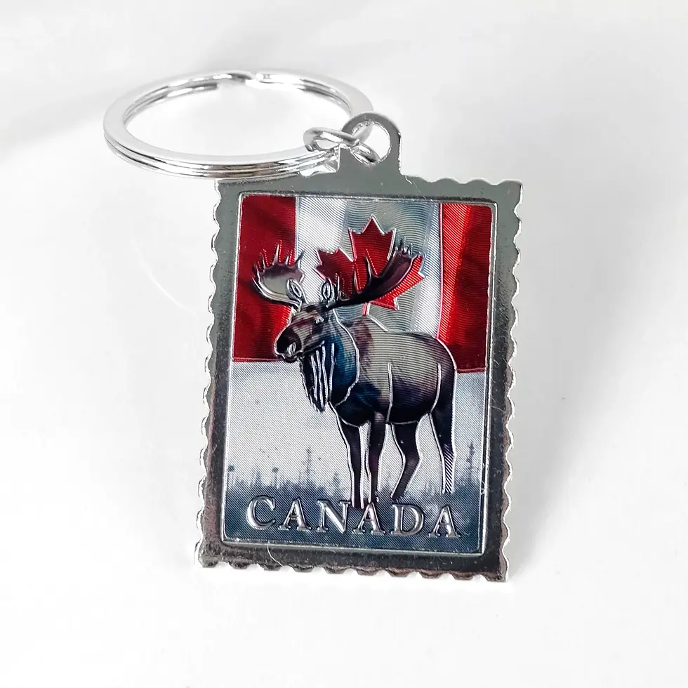 Postage stamp style keychain with moose and flag pattern at Tickled Pink Ottawa.