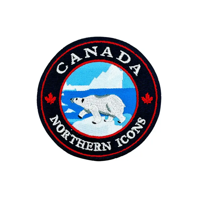 Round embroidered patch with text, 'Canada Northern Icons' & polar bear at Tickled Pink Ottawa
