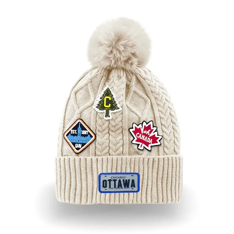 White cableknit pompom hat with Ottawa patches