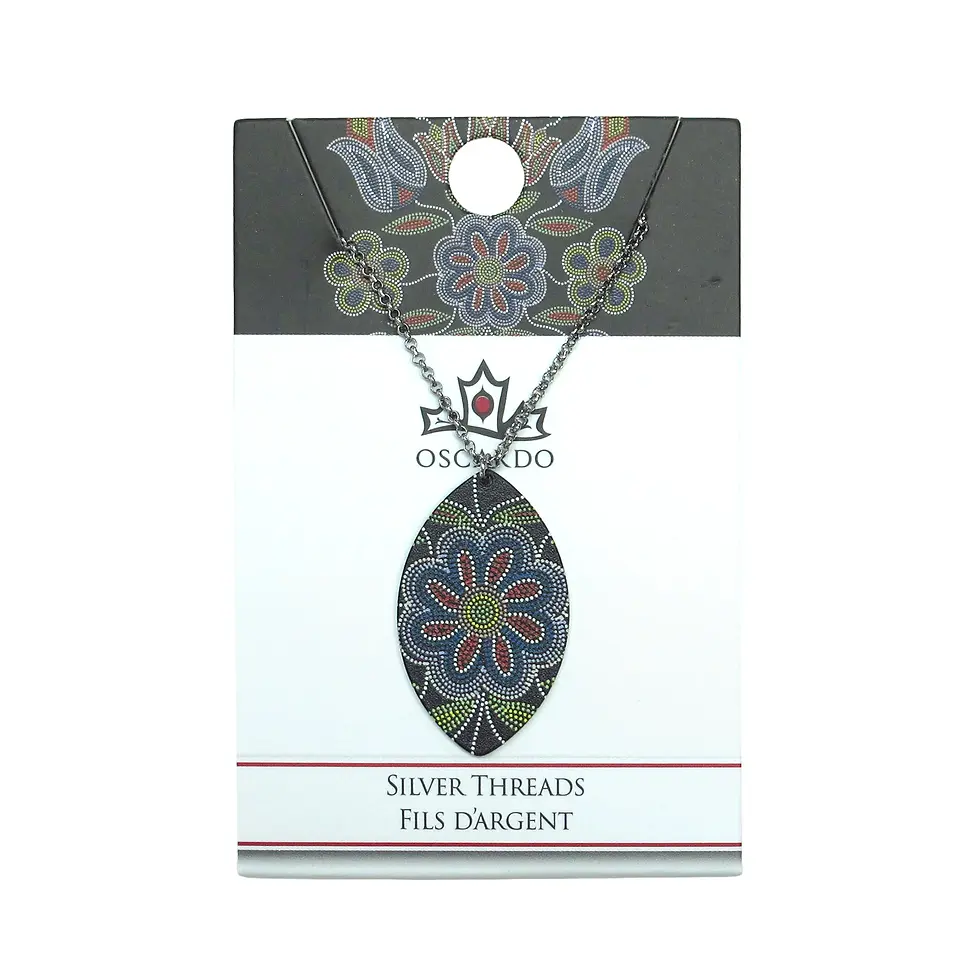 Thumbnail: Model wearing the Silver Threads necklace by Deb Malcolm on neckline at Quichua World Market in downtown Ottawa.