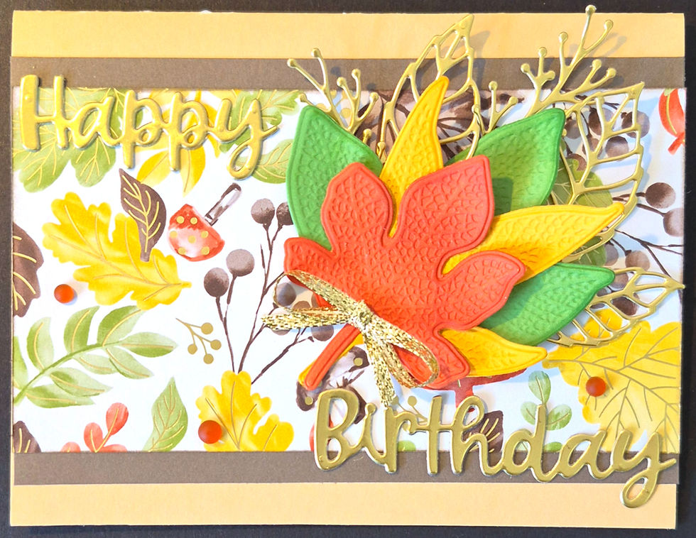 A horizontal handmade birthday card with a cluster of textured maple leaves and metallic birthday text at Tickled Pink.