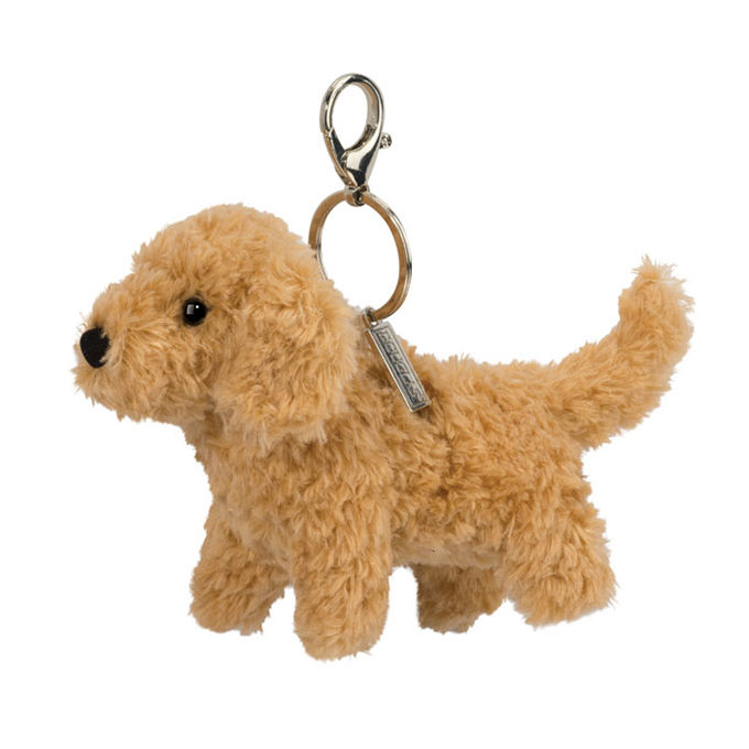 A small tan curly plush Douglas doodle dog bag charm named Milo with a silver metal keychain clip at Tickled Pink.