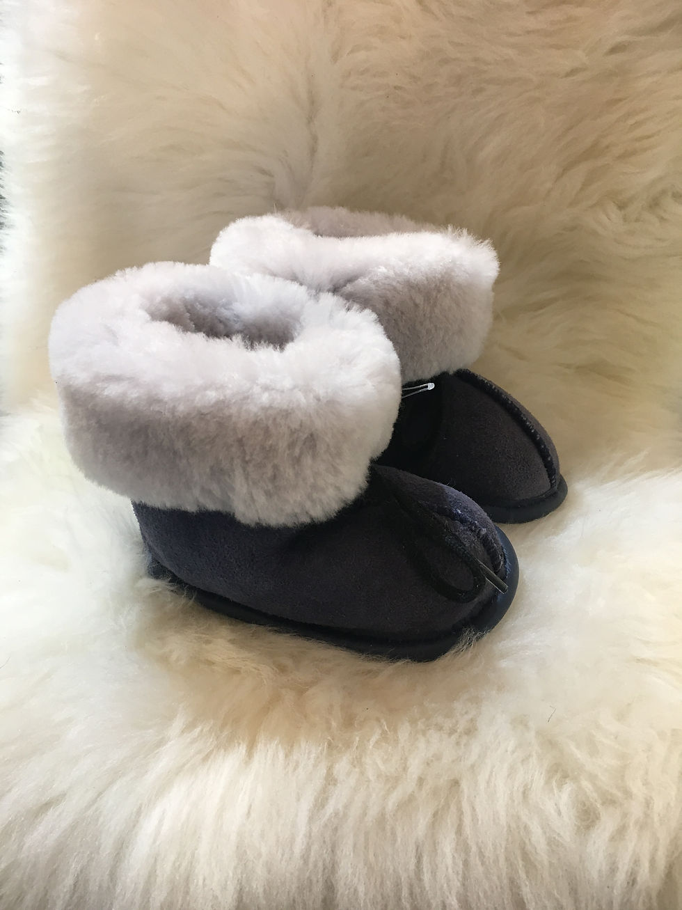 Thumbnail: Side view of pair of toddler denim sheepskin slippers
