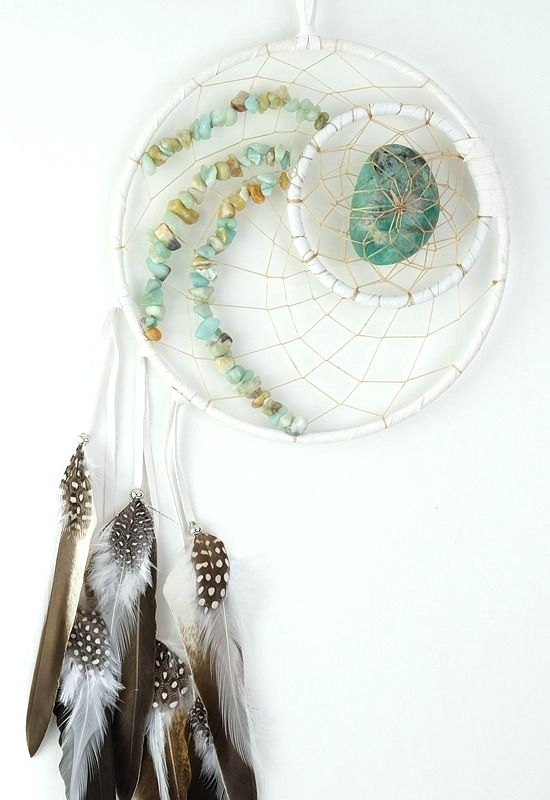 Double white dream catcher with small chunks of amazonite in web & offset brown feathers, large amazonite stone in center