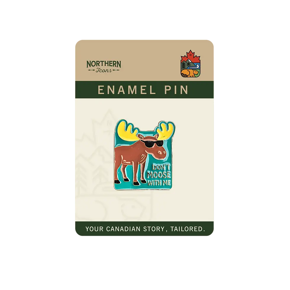 Don't Moose With Me enamel pin packaged on green & cream card