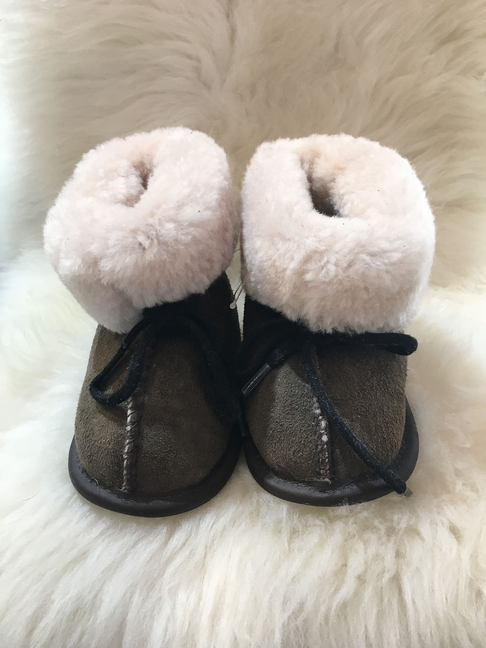 Thumbnail: Side view of pair of toddler denim sheepskin slippers