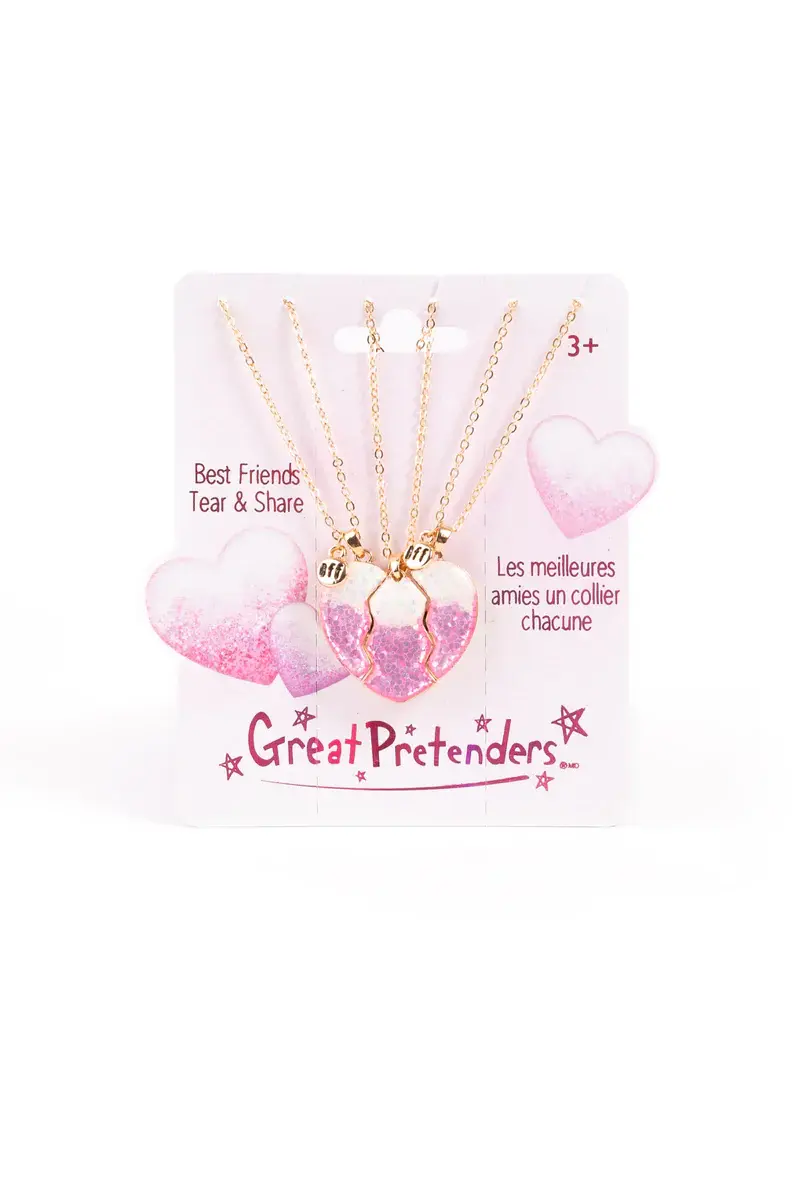 Set of 3 gold chains with 1/3 heart pendant on pink packaging