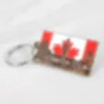 Canada flag keychain with copper parliament building silhouette