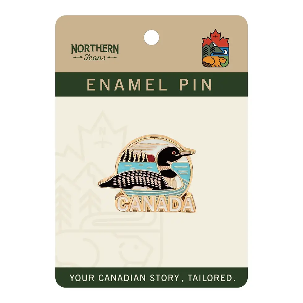Gold, black, white, & blue enamel pin in shape of loon with text, 'Canada', carded