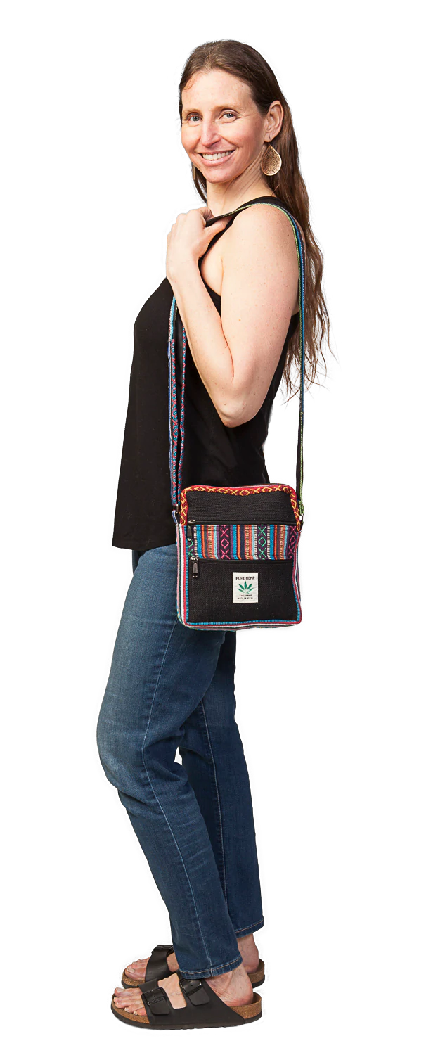 Model with black rectangular zippered shoulder bag with 2 outer zippered compartments & multi-color patch on flap