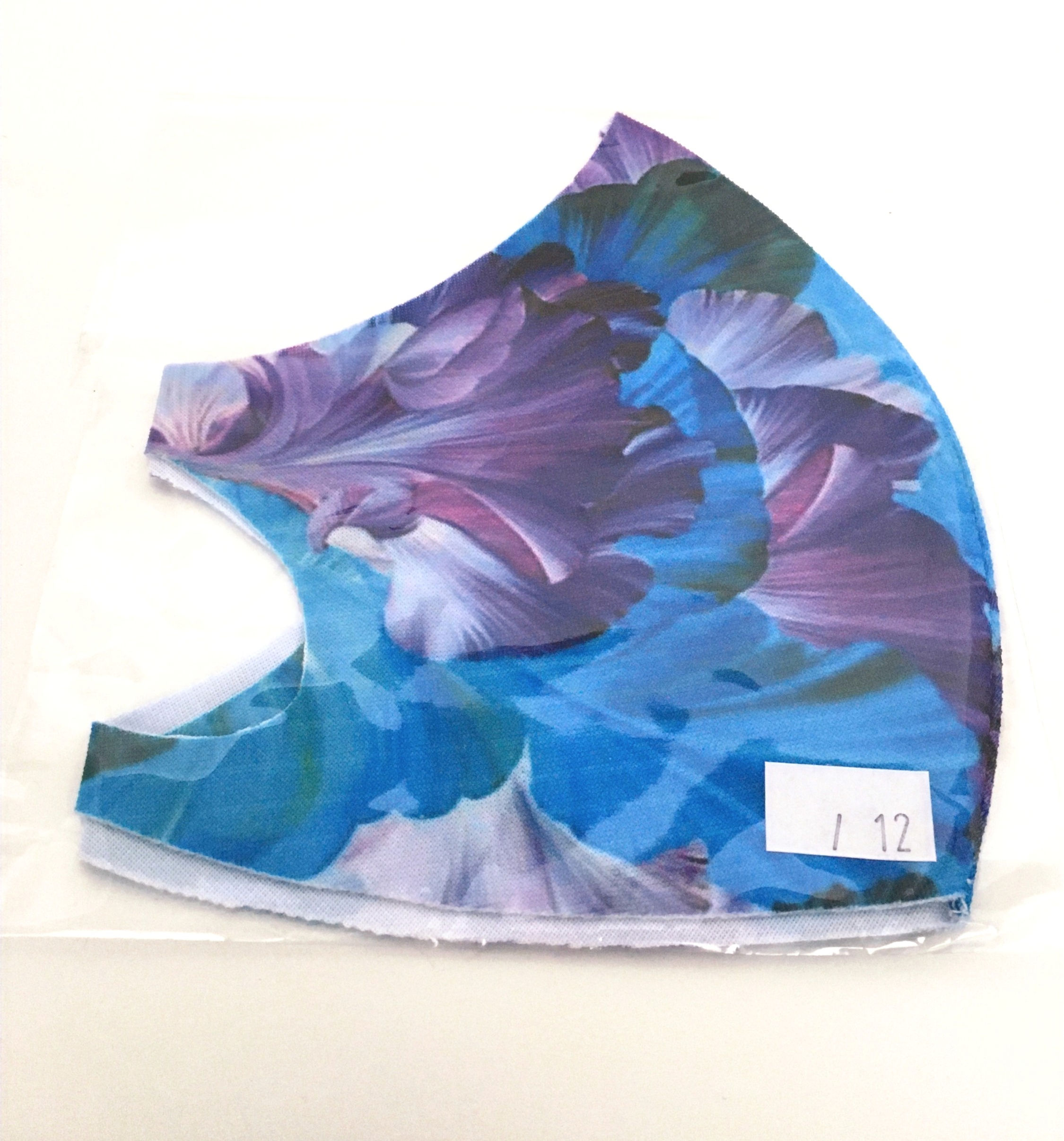 Side view of folded blue and purple large floral print mask
