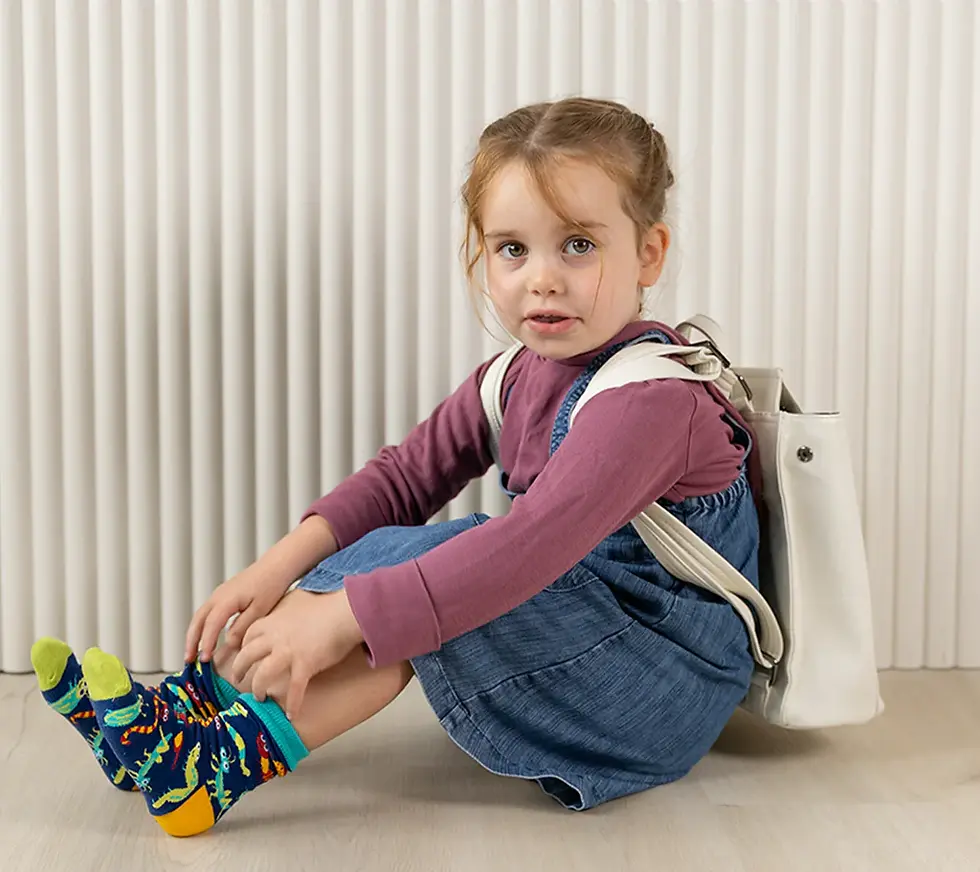 Buggin Out insect-themed kids socks lifestyle shot at Tickled Pink in ByWard Market.