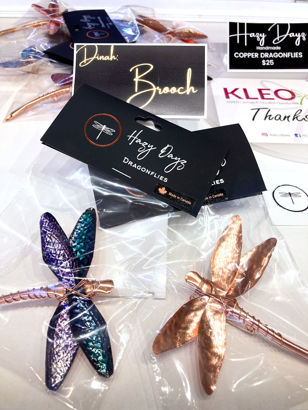 Thumbnail: Display of copper dragonfly pins in tray