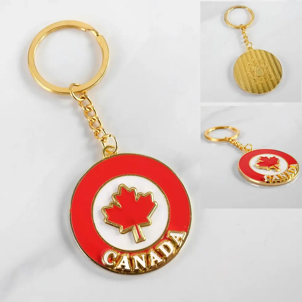 Red & white keychain with gold trim, Canada in white letters & red maple leaf at center
