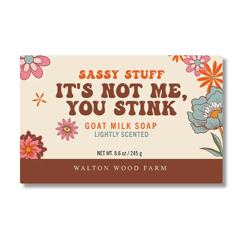 Orange & brown floral paper wrapped bar soap labelled It's Not Me, You Stink bar soap
