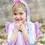 Thumbnail: Smiling little girl wearing unicorn princess hair braid with pink horn & flowers